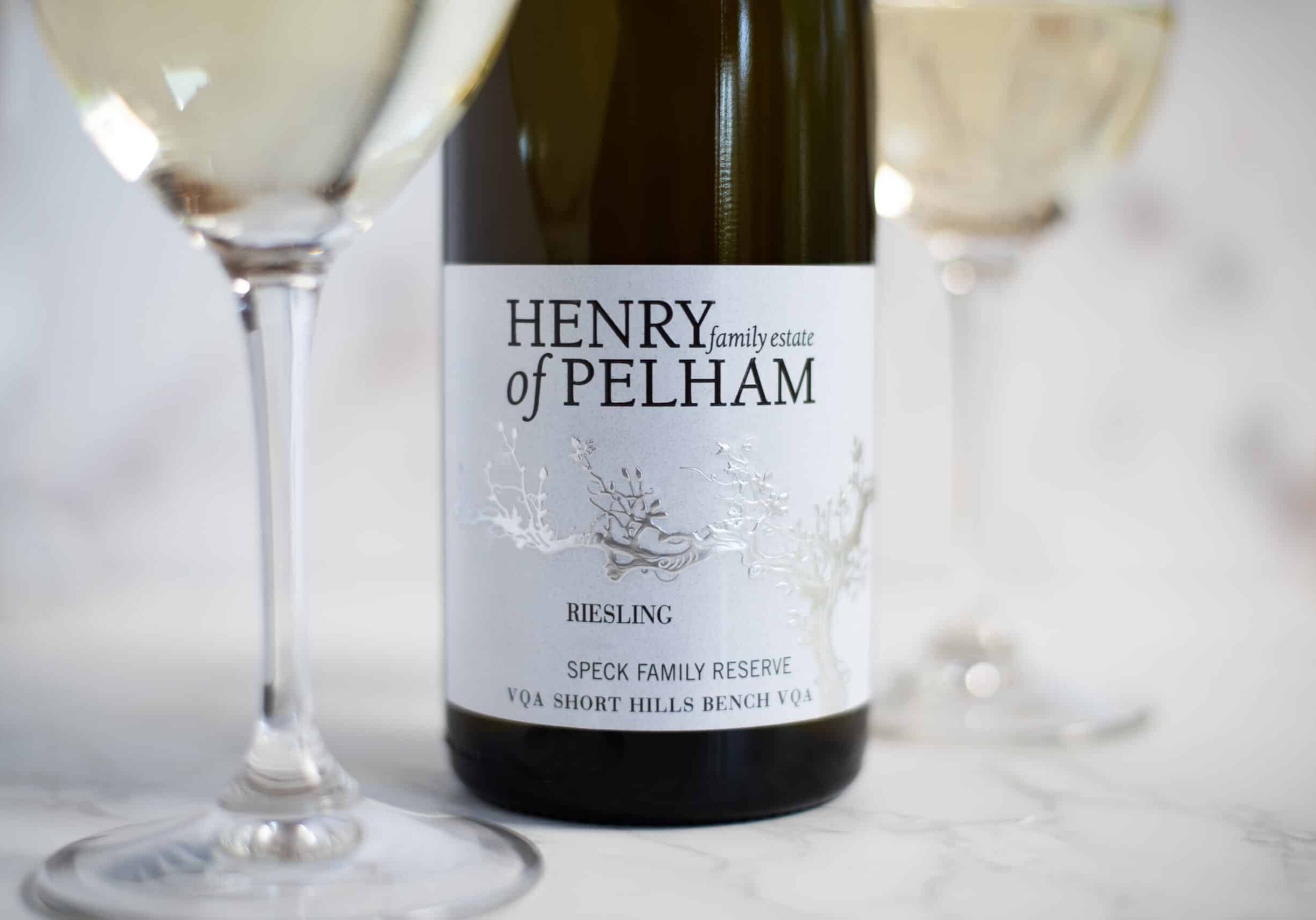 Henry of Pelham's Speck Family Reserve Riesling with two full wine glasses