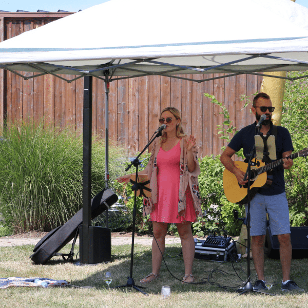 Two people singing at Henry of Pelham winery